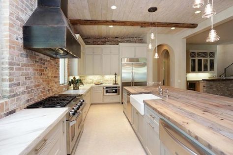 pale gray cabinets; raw steel hood; exposed brick backsplash; marble & reclaimed wood counters Reclaimed Wood Counter, Exposed Brick Kitchen, Brick Kitchen, Brick Backsplash, Casa Vintage, Brick Design, Transitional Kitchen, Grey Cabinets, Wood Countertops