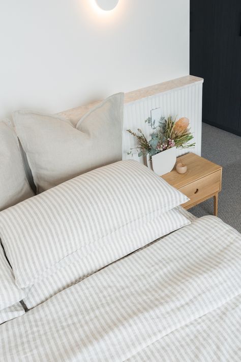 How to build a ledge wall: Convex and pink terrazzo shelf wall Built In Bedside Tables Master Bedrooms, Nib Wall Bedhead, Built In Bedside Tables, Behind Bed Shelf, Built In Bedhead, Bedroom Ledge, Pink Terrazzo Tile, Diy Ledge, Timber Bedside Table