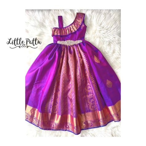 Little Pattu (Toronto, Canada) | Pure Kanchipuram purple with temple gold zari made in a one shoulder dress style!! Ask for your 1 shoulder kanchipuram dress | Instagram Pattu Dress For Kids, Pattu Frocks For Kids, Small Girls Dress, Kids Saree, Traditional Baby Dresses, Baby Lehenga, Pattu Langa, Frock Models, Baby Dress Embroidery