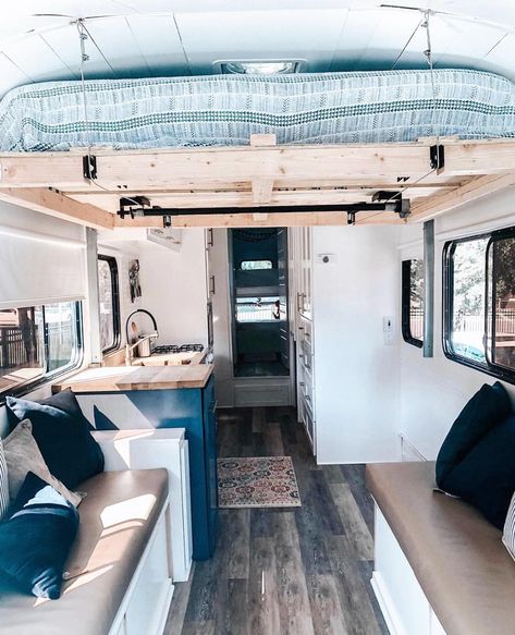 A skoolie with lifted bed 🛌! I wonder if I can do this without the roof raises.... —————— Check out 🚌💨 @americanfamilyroadtrip Really cool… Lifted Bed, Caravan Renovation Diy, Caravan Interiors, School Bus Tiny House, School Bus Camper, Bedroom Wall Decor Ideas, Bed Lifts, Bus Living, Kombi Home