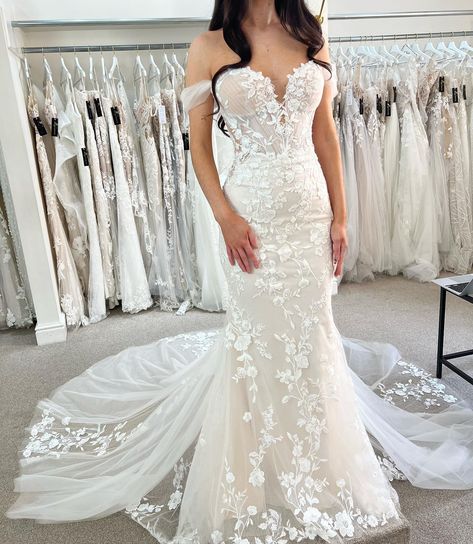 Would you say ‘I do’ to Prisha by Blue by Enzoani? 🕊🤍 Like floating on clouds in our dreamy Prisha. This breathtaking mermaid gown features floral cotton lace that wraps around the silhouette of the gown. The laser cut floral lace balances perfectly with the detailed tulle bodice emphasizing the plunging sweetheart neckline. Change up this bridal look by removing the lovely detachable tulle sleeves for a more fun and flirtier look. The perfect gown for the Spring or Summer bride 💐 Would y... Detachable Tulle Sleeves, Tulle Bodice, Blue By Enzoani, Summer Bride, Tulle Sleeves, On Clouds, Bridal Look, Mermaid Gown, Bridal Boutique