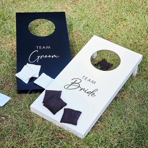 Have some fun with this cornhole wedding day game on your special day. 🤍🖤 It’s the perfect way to get the party started with your wedding guests! #weddingday #weddinggames #cornhole #cornholeboards #bridevsgroom #lawngames #gardenparty #wedding #weddinginspiration #weddinggarden #weddingideas Yard Games For Wedding Receptions, Wedding Outdoor Activities, Games For Market Day, Backyard Wedding Cornhole, Modern Rustic Wedding Decor Receptions, Cornhole For Wedding, Wedding Activities For Guests Indoor, Mr And Mrs Cornhole Boards, Summer Wedding Activities