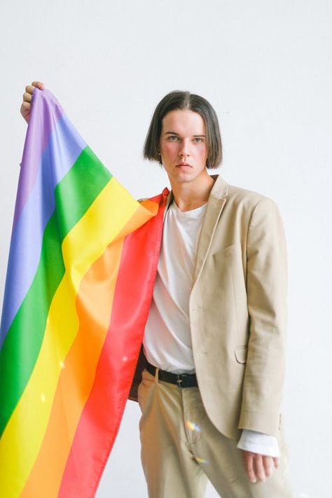 Pride Photoshoot Ideas At Home, Pride Photoshoot, Camera Makeup, Beige Suit, Gay Pride Flag, Lgbt Flag, People Clothes, Rainbow Flag, Men Model