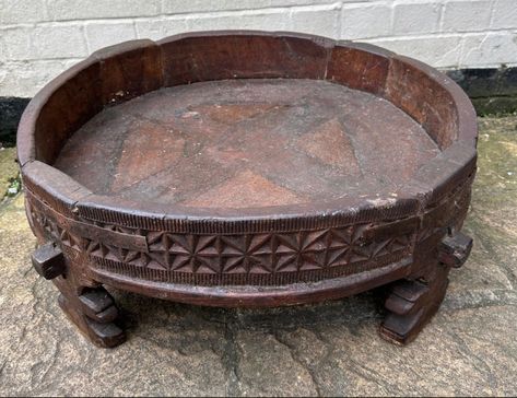 Antique Indian Chakki, grain grinding table.   Made from Solid Teak with iron brackets.  Perfect as a coffee table, plant stand.  I restore antiques as a french  polisher,  this will be hand waxed and finish revived in the coming days. more photos will be uploaded. 27cm high 68cm in diameter Coffee Table Plant, Iron Brackets, Hand Wax, Plant Stand, More Photos, Teak, Grain, Wax, Coffee Table