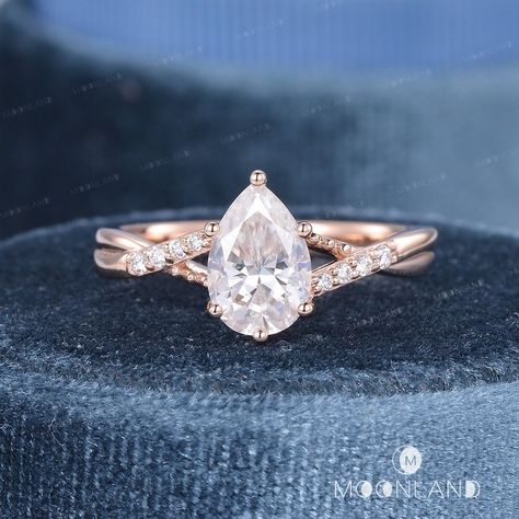 1.5CT Moissanite Engagement Ring Rose Gold Wedding Ring Pear Shaped Moissanite Ring Art Deco Ring Women Split Shank Ring Twist Ring Infinity Unique Ring Check the bridal set: https://www.etsy.com/listing/1312956716 Check the bridal set with pearl band: https://www.etsy.com/listing/1230486837 🌙 Product Details -Center Stone: Colorless Moissanite, 6*9mm, Pear Shaped -Weight about: 1.5CT -Colorless/D Color, VVS Clarity -Stone: Moissanite, DEF/VVS-VS or Natural Diamond, H Color, SI Clarity(choose o Split Band Pear Engagement Ring, Pear Rose Gold Engagement Ring, Pear Shaped Engagement Rings Rose Gold, Rose Gold Pear Engagement Ring, Pear Wedding Ring Set, Tear Drop Wedding Ring, Wedding Ring Pear, Pear Shaped Wedding Rings, Ring Pear Shaped