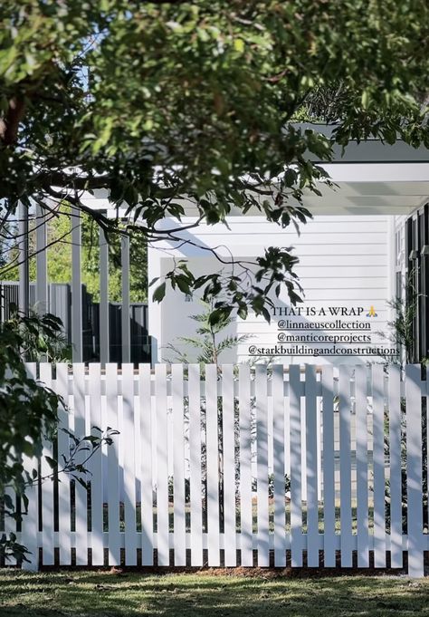 White Panel Fence, Coastal Fencing Ideas, White Picket Fence Front Yard, Cottage Fencing, White Wood Fence, Airbnb Investment, Hamptons Fence, Lawn Free Yard, Cottage Fence