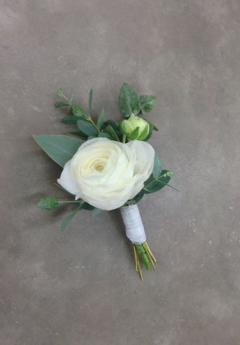 White ranunculus boutonnière with eucalyptus by Nancy at Belton Hyvee. White Flower And Greenery Boutonniere, White Ranunculus Boutonniere Wedding, White Lisianthus Boutonniere, Boutonniere Wedding Eucalyptus, Boutonniere With Greenery, White Boutineer Ideas, Boutineer Ideas Eucalyptus, Modern Minimalist Bridal Bouquet, White Modern Boutonniere