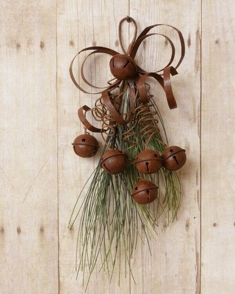 Here is a new winter pine teardrop pine spray hanger, this is made of artificial pine and metal , has pine and attached rusty tin bells and a rusty tin bow and ties, has 6 bells, and has attached hanger on top so can hang on wall hook or on an inside door hook, or shelf peg, measures 14 inch high by about 7 inch wide, nice winter spray hanger Teardrop Swag, Metal Bow, Rustic Holiday Decor, Christmas Board, Winter Decoration, Rustic Glam, Rustic Holiday, Bell Ornaments, Bow Ribbon