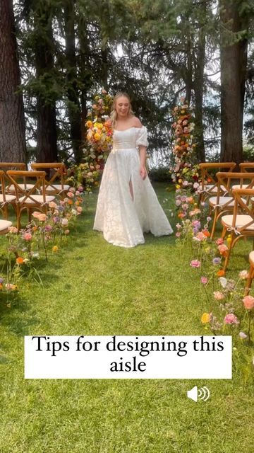 Eden Frei | Coeur D’alene Wedding Florist on Instagram: "Tips for designing this aisle you all adore: 1. The water picks pound into the grass better if it has soft soil. Use a rubber hammer. The picks also came out of the grass with less damage this way. 2. If water picks don’t insert easily, take a battery powered drill to help make the holes 3. This design used approximately 10 full stems per chair which we extended into the path as well. 3. Cut some flowers short and insert at varying heig Flowers Stuck In Ground Wedding, Wildflower Aisle Arrangements, Flower Path Wedding, Aisle Floral Decor, Wild Flower Wedding Theme Ceremony Decor, Flowers In Ground Wedding Aisle, Wild Flower Aisle Wedding, Flowers Lining The Aisle, Diy Aisle Flowers