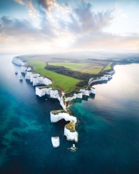 The White Cliffs of Dover, part of the North Downs formation, is the region of English coastline facing the Strait of Dover and France. The cliff face, which reaches a height of 350 feet (110 m), owes its striking appearance to its composition of chalk accented by streaks of black flint.  Photo Credit: ⁣📸 @tomwatphoto  #travel #wanderer #travelgoals #travelgram #travelphotography #traveling #travelling #travelblogger #traveler #traveller #traveltheworld #travelingram #travelblog #travels Weird Places, Travel Landscape, Jurassic Coast, Adventure Photography, Ecosystem, Awe Inspiring, Land Scape, Wyoming, Adventure Travel