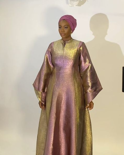 Rawsilk | Eid Dresses | Modest Fashion | Scarves | on Instagram: "Look 4   Metallic two toned Kaftan in magenta and gold  Also available in maroon and gold   Fabric: luxury Damask   Price : N95,000 Raw silk scarf : N6,500  Kindly click link in bio to place order  Worldwide shipping available" Metallic Organza Dress, Metallic Fabric Dress, Organza Bubu, Silk Abaya, Kaftan Styles, Damask Dress, Eid Dress, African Inspired Clothing, Chiffon Dress Long