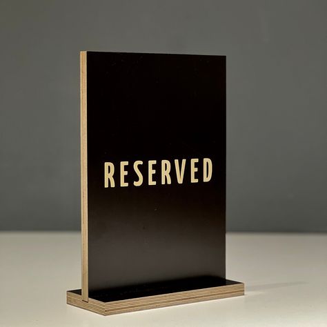 Looking for a stylish way to reserve your tables? Look no further than our custom wood signs! These beautifully engraved signs come in a variety of styles, including "reserved table," "reserved," and even "table numbers" for a more organized seating arrangement. Our signs also make great additions to your coffee bar or bar decor, adding a touch of rustic charm to any space. And for weddings, our wooden signs are the perfect way to direct guests to their assigned tables. Don't forget to check out Table Numbers Restaurant, Reserved Table Sign, Out Of Order Sign, Reserved Table Signs, Engraved Wood Signs, Cafe Sign, Table Number Holders, Sign Business, Wooden Wedding Signs