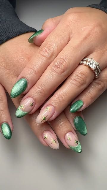 Jenny J Nailz on Instagram: "Hard gel structure manicure @nailthoughts Baby Cakes Base And custom mix green cat eye magnetic French With glitter confetti and gold stars. Green Christmas nails." Cute Emerald Nails, Structure Gel Nails Design, Green Cat Eye Nails Christmas, New Years Nail Designs Cat Eye, Cat Eye Nye Nails, Olive Cat Eye Nails, Dark Green Cateye Nails, Jade Cat Eye Nails, Simple Cateye Nail