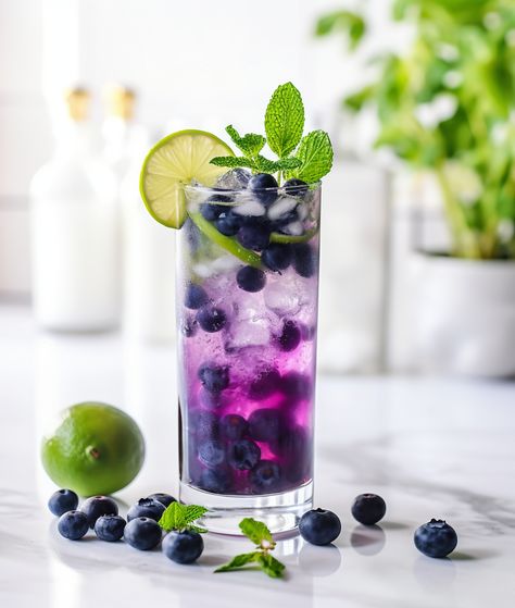 Blueberry mojito Lemon And Mint, Blueberry Mojito, Blueberry Mint, Cocktail Umbrellas, Nugget Ice Maker, Nut Free Recipes, Blueberry Juice, Colorful Cocktails, Mojito Recipe