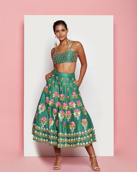 We have a ton of midi options for you and they’re perfect for your most festive events! Check out our brand new pieces in the “What’s New” section on www.bisouNYC.com Stylish Lehenga Designs, Short Lehenga, Lotus Motifs, Pink Shells, Mehndi Outfit, Mehendi Outfit, Haldi Outfit, Mehendi Outfits, Tie Dye Fashion