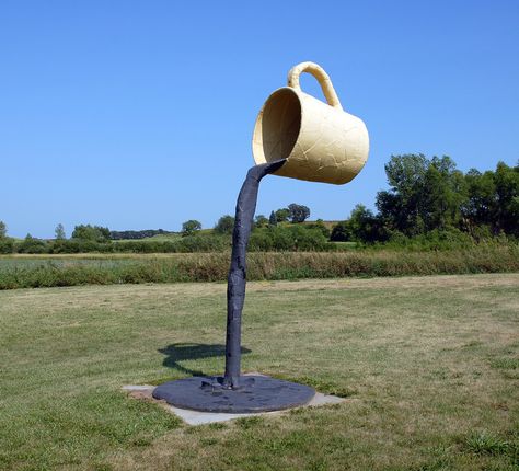 https://flic.kr/p/krGdW | Coffee Cup Sculpture, Vining, MN | This is my favorite - because there's only the blue and green behind it, and the sun is shining right on this. And I do love coffee. Cup Sculpture, Tea Cup Display, Pouring Coffee, Street Art Illusions, Coffee In The Morning, Coffee Barista, Coffee Images, Local Coffee Shop, Unique Sculptures