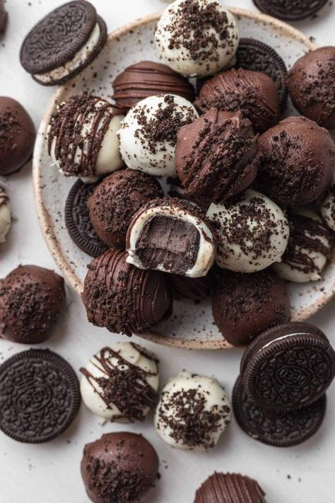 An overhead view of a stack of Oreo cream cheese balls on a speckled white plate. One ball has a bite missing. Oreo Cream Cheese Balls, Cream Cheese Balls, Crawfish Dip, Oreo Ball, Oreo Cream Cheese, Live Well Bake Often, Oreo Balls Recipe, Oreo Cream, Pretty Desserts