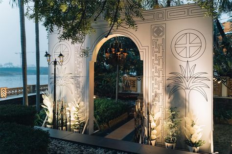 Step into a world of elegance through our grand entrance, designed with care to leave a memorable impression. Design and decor - @totheaisle_weddings Planning - @sapphireyourevents 📍- @theleelapalaceudaipur #ToTheAisle #ToTheAisleWeddings #WalkToTheAisle . #IndianWeddingdesigners #WeddingDecor #Decor #Leela #Udaipur #WeddingPhotography #Luxury #Design #Indianwedding #Origami #WeddingDay #Destinationweddingsplanner #Decorationideas #Floral #Weddingorganizer #Weddingseason #Blackwhite #De... Leela Udaipur, Hindu Wedding Entrance Decor, Marriage Entry Gate Decoration, Sangeet Entry Gate, Udaipur Palace Wedding, Brihadisvara Temple, Wedding Organization, Udaipur, Grand Entrance