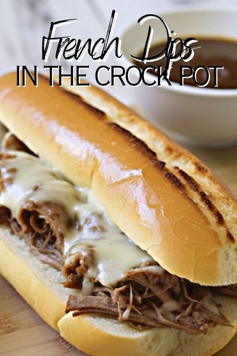 french dips in the crockpot written with a picture of a hot beef french dip sandwich with homemade au jus sauce in the background Crock Pot French Dip Sandwiches, Crockpot French Dip, Crock Pot French Dip, Crock Pot Sandwiches, Chuck Roast Crock Pot Recipes, Crock Pot Chuck Roast, French Dip Sandwich Crockpot, French Dip Recipes, French Dip Crock Pot