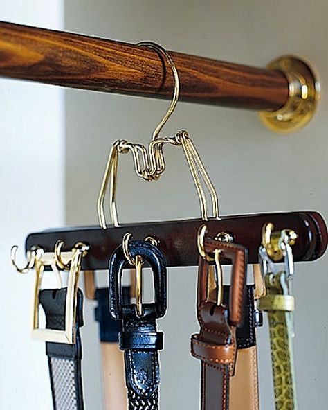 Predrill a row of holes in alternating spots on both sides of a wooden clamp hanger, and screw in cup hooks. Make as many of these hangers as you need to accommodate your belts. If you like keeping... Bedroom Organizers, Cup Diy, Diy Belt, Pants Hanger, Belt Rack, Diy Pants, Trouser Hangers, Belt Hanger, Diy Belts