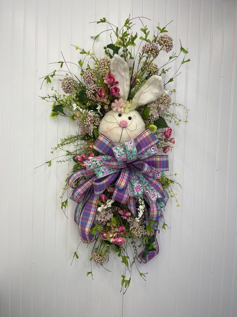 This DIY Easter Wild Flower Bunny Swag is a perfect addition to your spring front porch decor. Learn how to DIY this today! Bunny Wreaths For Front Door, Diy Swag, Spring Front Porch Decor, Easter Swags, Wreath Swag, Easter Door Wreaths, Rabbit Wreath, Winter Arrangements, Easter Spring Wreath