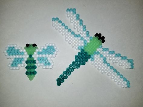 Glow in the dark perler dragonflies! Dragonfly Perler Beads, Dragonfly Perler Bead Pattern, Perler Bead Dragonfly, Luna Moth Perler Bead Pattern, Insect Perler Bead Patterns, Bug Perler Bead Patterns, Moth Perler Bead Patterns, Melt Beads Patterns, Beaded Dragonfly