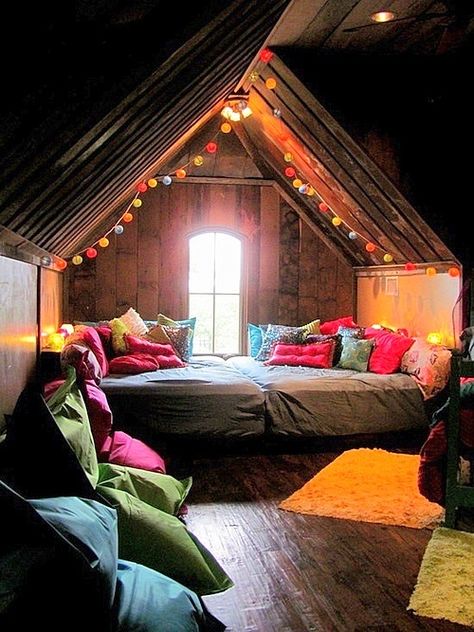 Your bedroom, a cozy nest in the attic with string lights sending colour all over and pillows everywhere for all the seances you have. Design Ložnic, Attic Space, Attic Renovation, Attic Remodel, Attic Bedroom, Deco Boheme, Attic Rooms, Perfect Bedroom, Cozy Nook