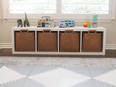 Toy Storage Bench Living Room, Modern Toy Storage Bedroom, Little Boy Bedroom Toy Storage, Window Bench Toy Storage, Toy Bin Storage Ideas, Toy Storage Under Window, Attractive Toy Storage Living Room, Toy Storage In Front Of Window, Ways To Organize Toys In Living Room