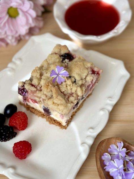 Snacking on fresh summer berries is a treat I look forward to every year. Making desserts with berries is even more anticipated! So I decided to share my dreamy Triple Berry Crumble Cheesecake bars… Desserts With Berries, Brownie Mischief, Triple Berry Crumble, Crumble Cheesecake, Making Desserts, Berry Crumble, Berry Dessert, Ceramic Baking Dish, Raspberry Sauce