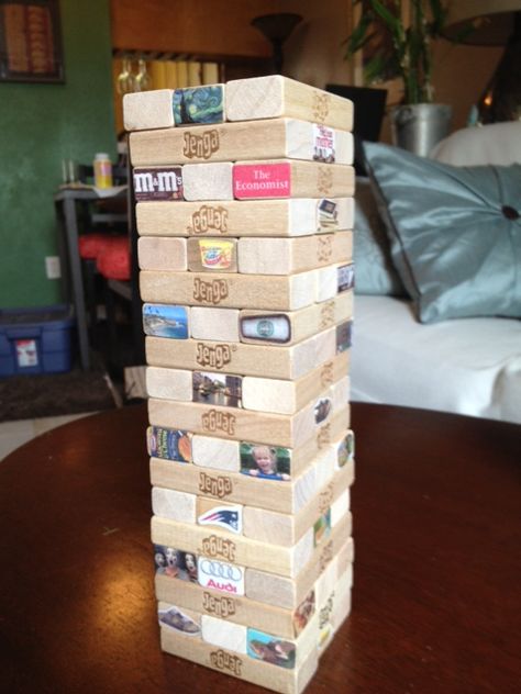 I made this customized Jenga game for my deployed boyfriend. Really simple and easy to make. Shrink down photos and/or clip art to 1/2 inch by 1 inch and use Modge Podge to glue and seal them on.   I customized the container by adding the title, "Beat the Deployment Blues Jenga: Things to Make you Smile, Laugh, and Look Forward to." Can't wait for him to get back so we can play! Could also be a really cute Christmas present filled with family photos. Hopefully this pin slips past my family! Jenga For Couples, Custom Jenga, Build Memories Jenga Sign, Giant Jenga Wedding, Customized Jenga Game, Wedding Guest Book Jenga Blocks, Deployed Boyfriend, Inside Activities, Bf Stuff