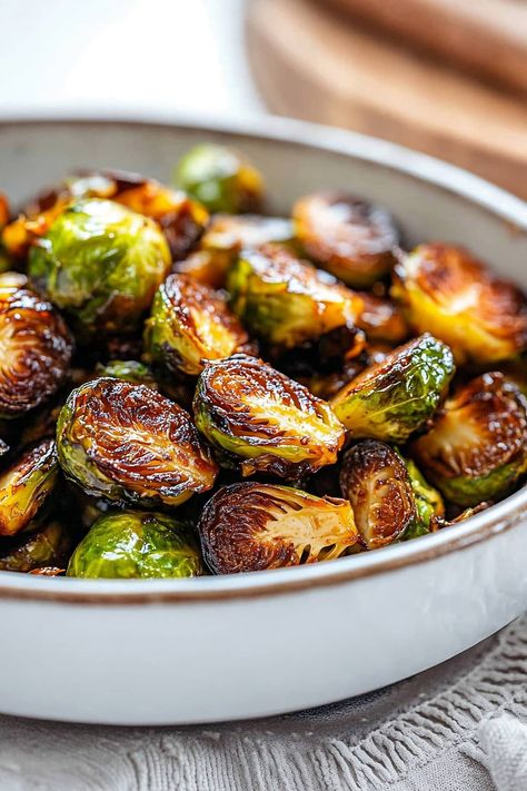 With a sweet and tangy glaze and irresistibly crispy, caramelized edges, these Brussels sprouts are sure to convert any skeptics. They're absolutely addictive! Brussel Sprout And Carrot Recipes, Flash Fried Brussel Sprouts, Carmelized Brussel Sprouts Recipe, Crispy Brussel Sprouts Oven, Stove Top Brussel Sprouts, Candied Brussel Sprouts, Carmelized Brussel Sprouts, Best Brussel Sprout Recipe, Glazed Brussel Sprouts