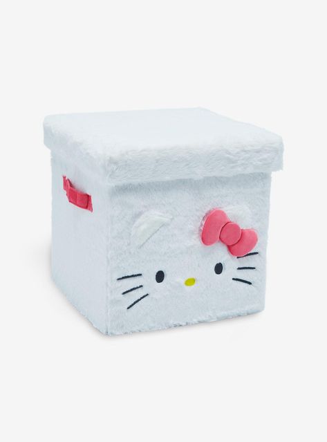 Keep all of your kawaii belongings stored safely with Hello Kitty! This Sanrio storage cube is a fuzzy material and has a sturdy body and lid  plus Hello Kitty's face  3D ears and bow on the front. Comes with side handles.13" x 13" x 13"PolyesterLid & MDF insertSide handlesImported Hello Kitty Furniture, Sanrio Storage, Plush Storage, Apartment Must Haves, Hello Kitty House, Storage Cube, Hello Kitty Accessories, Kitty Plush, Hello Kitty Christmas