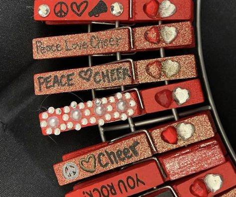 Cheer Peg Ideas, Cheer Pins For Backpacks Ideas, Cheer Close Pin Ideas, Good Luck Cheer Clothes Pins, Cheer Pins Diy, Cheer Pins For Backpacks, Cheer Pin Ideas, Cheerleading Clothespins, Cheer Clothes Pins