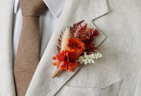 Rust Terracotta Boutonniere,Burnt Orange Rose Boutonniere,Groom Boutonniere,Wedding Accessories,Groomsmen Boutonnière,Wedding Boutonnière  Corsage size 14 x 7 cm. Boutonniere size is 10-13cm. Each floral piece is handcrafted with the same components however each of them arranged slightly different. Whilst all bouquets are packed carefully, some shedding may occur during transit.Thank you for your understanding. About take care: As long as you keep them away from direct sun, store in cool and dry areas they last for years to come. Corsages and boutonnieres for wedding, prom, or any formal occasion. Great as a boho, garden, and country themed weddings too! ------------------------------------------------------------------------------------------------------ We matching bridal bouquet, brides Terracota Boutonniere, Orange Rose Boutonniere, Terracotta Boutonniere, Burnt Orange Boutonniere, Rose Boutonniere Wedding, Wedding Lapel, Lapel Pins Wedding, Button Holes Wedding, Groomsmen Boutonniere