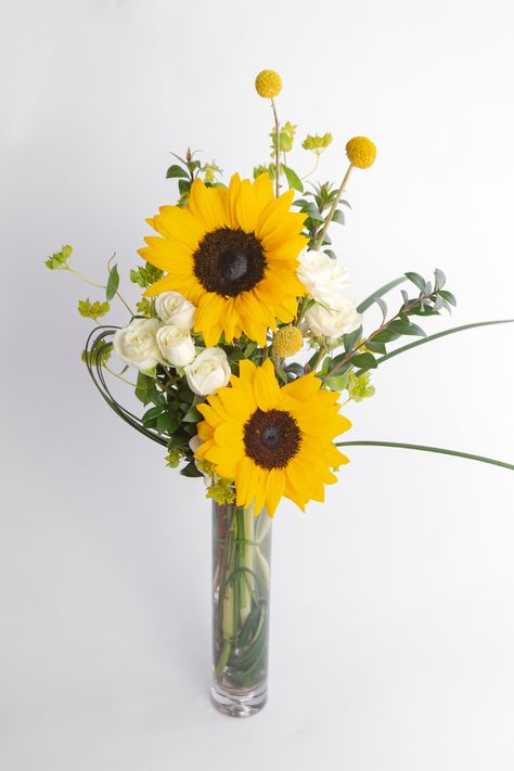 These locally-grown sunflowers are the perfect way to show gratitude for Administrative Professionals Week! This cheerful display of sunflowers and ivory mini roses comes in a classic slender glass cylinder budvase. Bring some sunshine to their workspace with these bright blooms - Click Link to Shop Sunflower Arrangements Vases, Red Roses And Sunflowers, Bud Vase Centerpiece, Valentine Flower Arrangements, Welcome Flowers, Sunflower Vase, Rose Spray, Small Flower Arrangements, Sunflower Arrangements