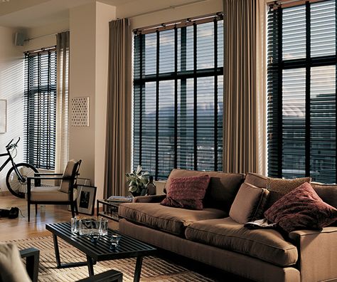 Industrial living room with a dark beige couch and high ceilings. Floor to ceiling curtains. Industrial Window Treatments, Loft Curtains, Vintage Industrial Interior, Industrial Windows, Industrial Apartment, Loft Furniture, Window Treatments Living Room, Industrial Livingroom, Industrial Interior Design