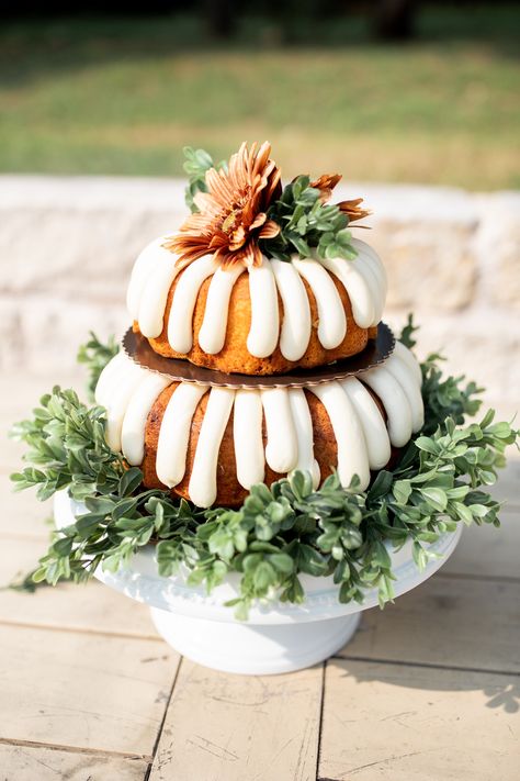 Wedding Cake tip: not a big cake person, Nothing Bundt Cakes and leftover greenery & flowers can do the trick and look amazing! #outdoorwedding #weddingceremony #weddingday #texaswedding #fallwedding #airbnbwedding #covidwedding #smallwedding #dreambackyardwedding #oncloudnunez Everything Bundt Cakes, Bundt Cake Decorations, Greenery Flowers, Big Cake, Cake Centerpieces, Nothing Bundt, Surprise Baby Shower, Nothing Bundt Cakes, Homemade Wedding