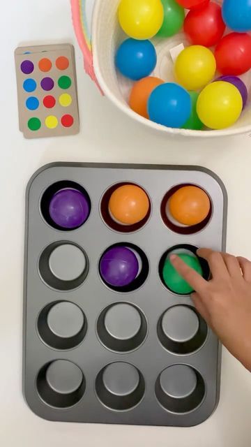 Two to Love - DIY Learning | Sensory | Crafts for Kids on Instagram: "🔴 Muffin Tin Coding 🔵 Muffin tin is not just for baking! We used it today for a simple coding activity. First, I made some coding/pattern cards using cereal boxes and dot stickers. Then I gathered different items to use to fill the segments of the muffin tin depending on the card. Items that we used: ✅ Plastic Balls ✅ Magnetic Tiles @magblox.au ✅ Felt Balls 🤚🏼 For the felt balls/pom-poms, encourage your little ones to Muffin Tin Activities, Math Activities Preschool Balls, Ball Activity For Toddlers, Muffin Tin Sensory Play, Montessori Ball Pattern, Montessori Puzzle Ball, Matching Games For Toddlers, Cupcake Tray, Sensory Crafts