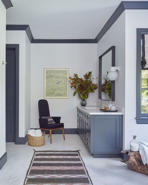 A piece of Cy Twombly artwork and a vintage Spanish woven basket from Hollywood at Home add personal touches to the bathroom. Dark Trim, Guest Bathrooms, Bathroom Pictures, Painting Trim, Blue Bathroom, Blue Trim, Sims House, California Homes, Architectural Digest