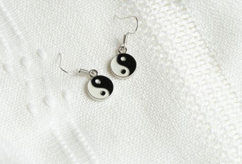 Add balance and style to your wardrobe with these yin yang earrings! Featuring a beautiful combination of black and white, these fashion earrings are the perfect accessory for any outfit. The drop and dangle design adds a unique touch, making them a fun and eye-catching addition to your collection. Plus, they make a great gift for friends who love unique and meaningful jewelry! • Earring Charm: Alloy Enamel Charms, Cadmium Free & Nickel Free & Lead Free,Gold or Platinum Color • Earring wire: -18 Earring Charm, Earring Wire, Studded Necklace, Meaningful Jewelry, Jewelry Earring, Personalized Keychain, Pearl Gemstone, Enamel Charms, Personalized Necklace