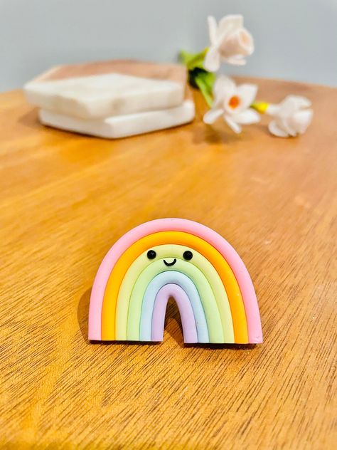 This rainbow  magnet is the cutest addition to your fridge to make you smile when you walk through the door. It's a perfect gift for a housewarming party or a dessert lover! Each piece is fitted with an N52 ultra strength magnet that is 8mm x 3mm.  Magnets vary in size due to custom nature of each piece, this particular magnet is approximately 1.25- 1.5 inch. Due to the handmade nature of these pieces, each magnet should be handled with care and may vary slightly from the picture shown, but due Mouldit Clay Fridge Magnet, Simple Clay Projects, Handmade Fridge Magnets, Cute Refrigerator, Office Fridge, Polymer Clay Magnet, Rainbow Magnet, Kitchen Magnets, Diy Magnets