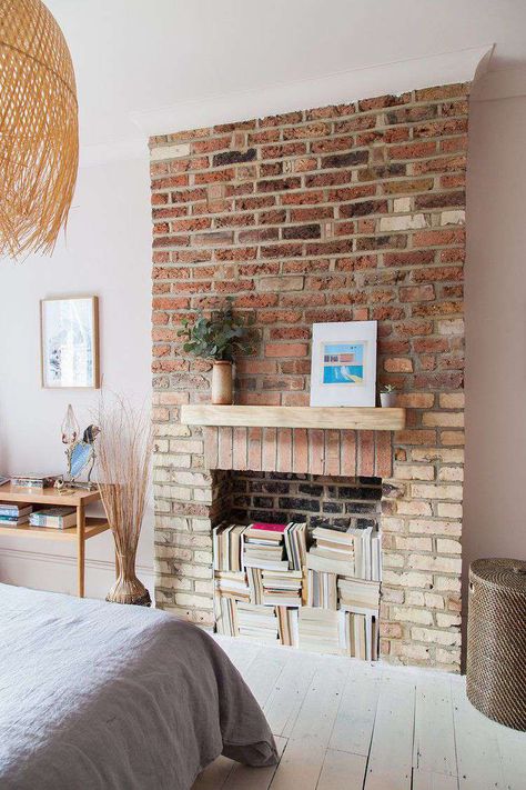 57 Fireplace Decor Ideas That Will Warm Your Hearth Fake Brick Fireplace Ideas, Fake Brick Fireplace, Exposed Fireplace, Scandi Bedroom Decor, Black Fireplace Surround, Brick Fireplace Ideas, Exposed Brick Fireplaces, Victorian Flat, Fireplace Accent Walls