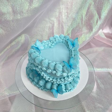 Kailey | Custom Cakes 🧚🏻‍♀️ on Instagram: "I mean… this color 😍 Used @colour.mill baby blue • #cakesofinstagram #cakesofig #cakes #buttercream #buttercreamcakes #birthdaycake #buttercreamdecorating #wilton #wiltoncakes #wiltontips #cakedecorating #cakes #shellborder #puyallup #puyallupcakes #tacoma #tacomacakes #ruffleborder #seattle #seattlecakes #pastelcakes #vintagecake #prettycake #butterflycake #aquarius #colourmillmade #colourmill" Light Blue Cake Birthday, Aquarius Heart Cake, Aquarius Cake Birthdays, Butterfly Heart Cake, Baby Blue Birthday Cake, Blue Girly Birthday Cakes, Blue Colour Cake Designs, Blue Butterfly Birthday Cake, Blue Aesthetic Cake Designs