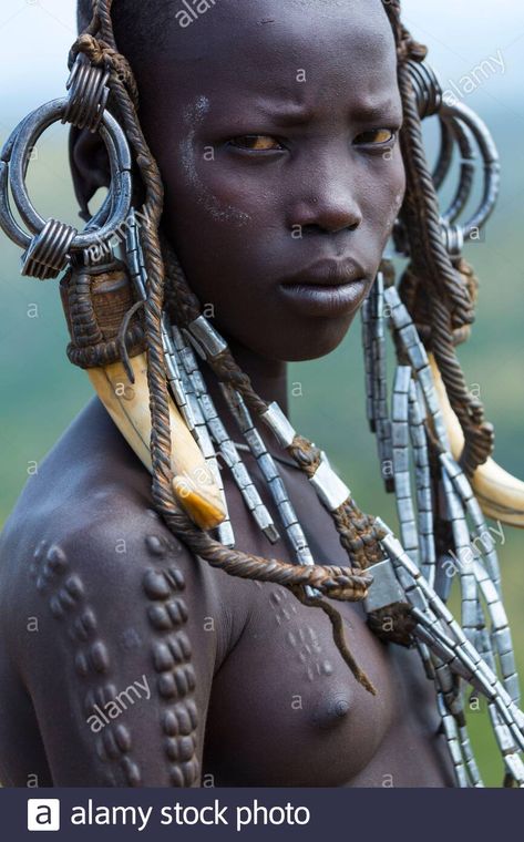 Download this stock image: Mursi people, Omo valley, Naciones, Ethiopia, Africa - 2AJ38RC from Alamy's library of millions of high resolution stock photos, illustrations and vectors. Ethiopian Tribes, Ethiopia Travel, Africa Tribes, Mursi Tribe Ethiopia, Mursi Tribe, African People, Vintage Portraits, Africa Travel, Stock Pictures