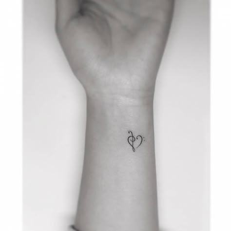 Bass and Treble clef heart. Treble Bass Clef Heart Tattoo, Treble Clef Bass Clef Tattoo, Fine Line Treble Clef Tattoo, Heart Tattoo Fine Line, Bass Clef Tattoo, Music Wrist Tattoos, Bass And Treble Clef, Music Heart Tattoo, Music Symbol Tattoo