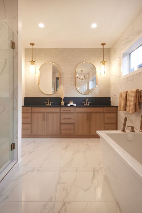 The primary bathroom featuring oak cabinets, champange bronze fixtures, soap stone quartz countertops. Bathroom Brown Countertop, Beige Gold Bathroom, Negresco Honed Granite, Golden Oak Trim, Bathroom Design Wood, Brown Countertop, Bathroom Brown, Quartz Stone Countertops, Granite Bathroom