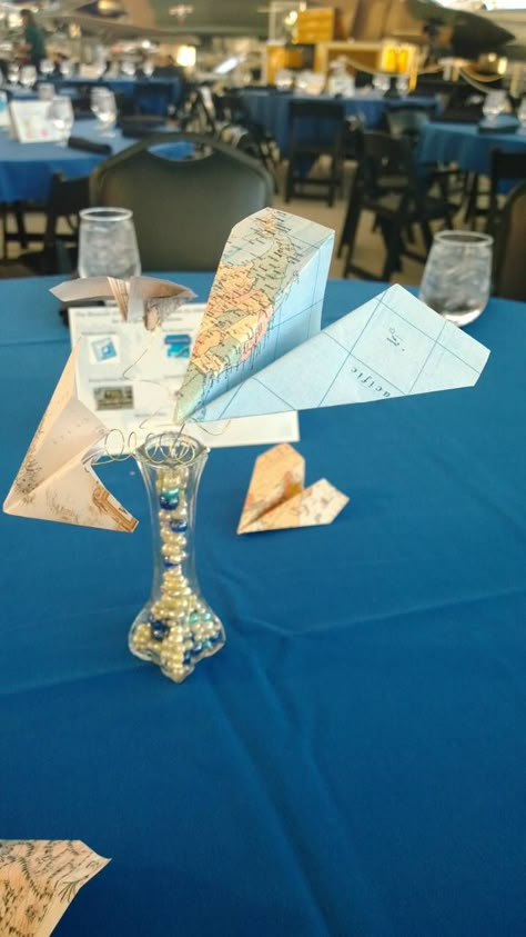 Paper airplane centerpiece Aviation Centerpieces, Paper Airplane Centerpiece, Pilot Graduation Party Ideas, Airplane Centerpiece Ideas, Airplane Decorations, Airplane Party Theme, Aviation Wedding Theme, Airplane Baby Shower Theme, Pilot Party