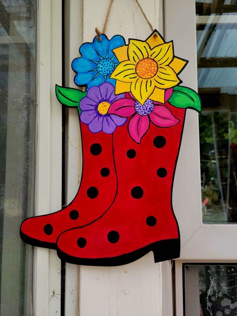 Painted this wooden cut out from HL. Painting Wood Cutouts Ideas, Wooden Door Flower Design, Wood Cutout Door Hanger, Flower Wooden Door Hanger, Painted Wood Flower Cutouts, Outdoor Wood Projects, Wooden Cutouts, Wooden Flowers, Outdoor Wood