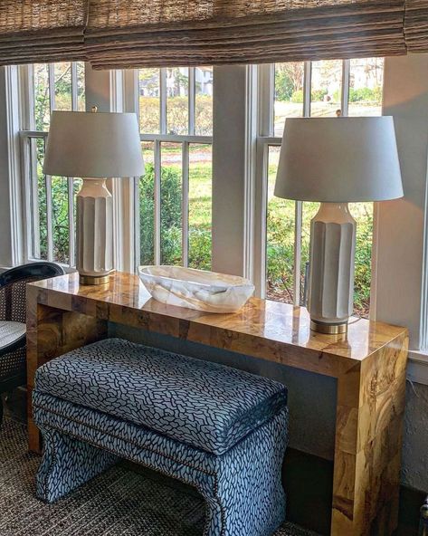 Modern History Furniture on Instagram: “Burl wood and blue. 💙 Can you think of a more beautiful pair? Styled to cover a tailored-made bench, designers @raganmagnessinteriordesign…” Burl Wood Bedroom, Art Over Entry Table, Burlwood Entry Table, Burl Console Table, Burlwood Console Table, Console With Ottomans, Console Table With Ottomans, Burled Wood Console Table, Burl Furniture