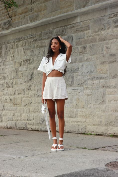 A breezy summer outfit idea for the heat wave. Linen shorts and a white top is one of my favourite combos for the season, plus this top is such a good jacquemus dupe!! white outfit| shorts | crop top | linen | sandals| white purse | summer outfit | fashion | platform sandals | White platforms sandals | white handbag | white shoulder bag White Sandals Outfit Black Women, Chic Off White Spring Sandals, White Sporty Sandals For Streetwear, White Open Heel Slides For Summer, Summer Off-white Sandals With Heel Strap, Rihanna Slides, White Sandals Outfit, Platform Sandals White, Platforms Sandals